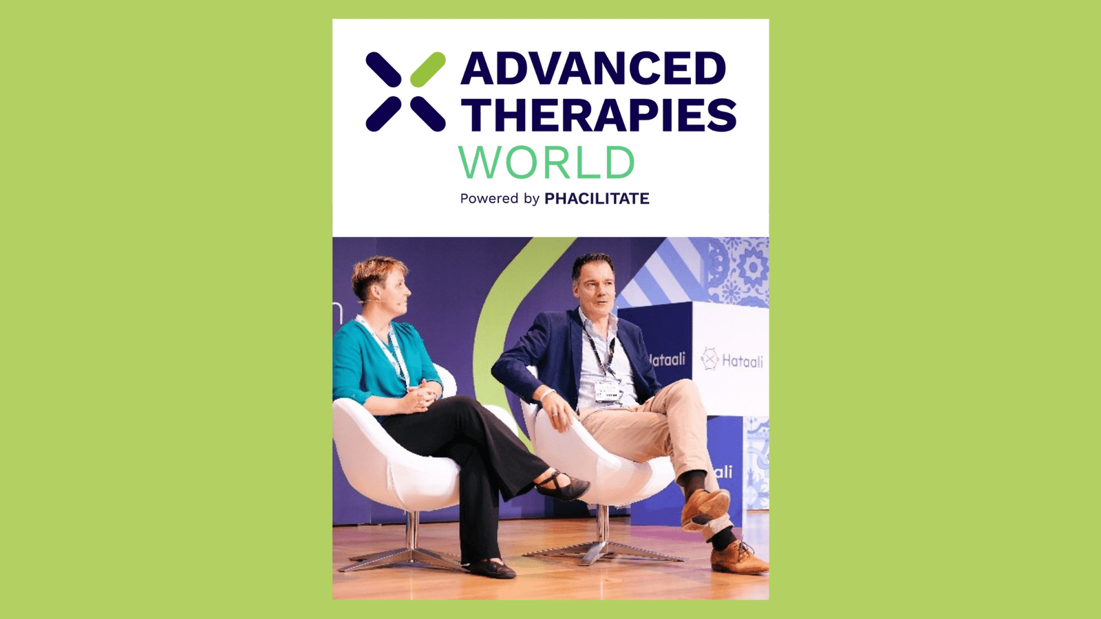 Two people sit and talk on stage in white chairs at the Advanced Therapies World event, with a large event logo above them and a green background surrounding the image.