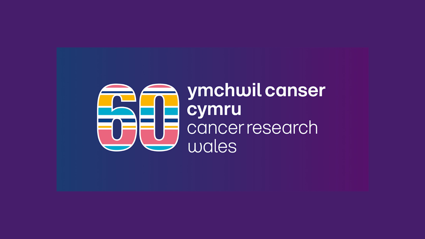 A colourful striped number 60 beside ymchwil canser cymru cancer research wales text, all on a purple background.